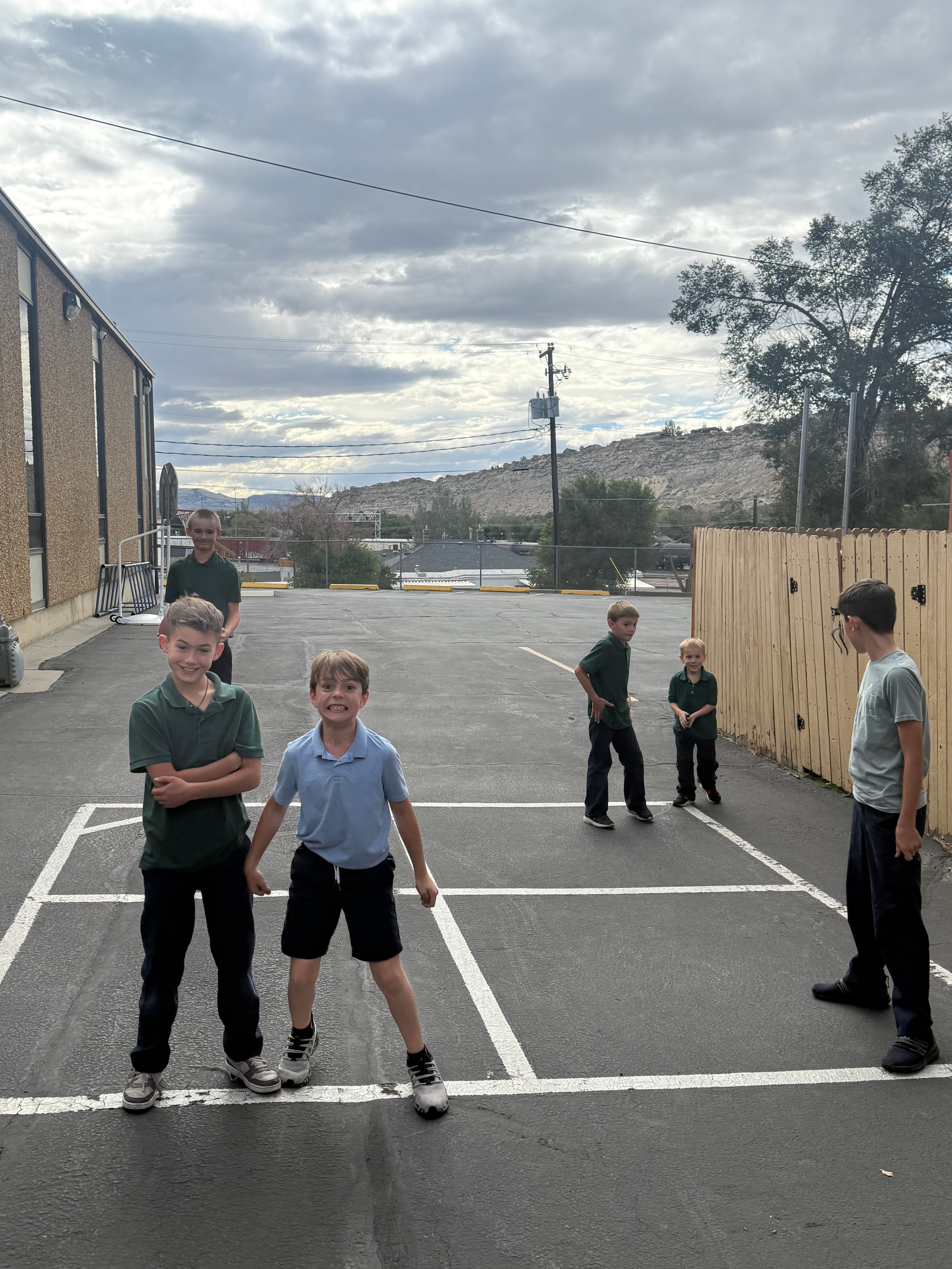 HSCS Extended Care students playing on the red playground equipment